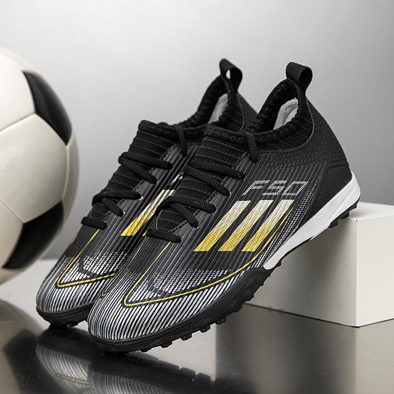 2025 new children's football shoes boys and girls broken nails T people grass students game training football shoes 31-40