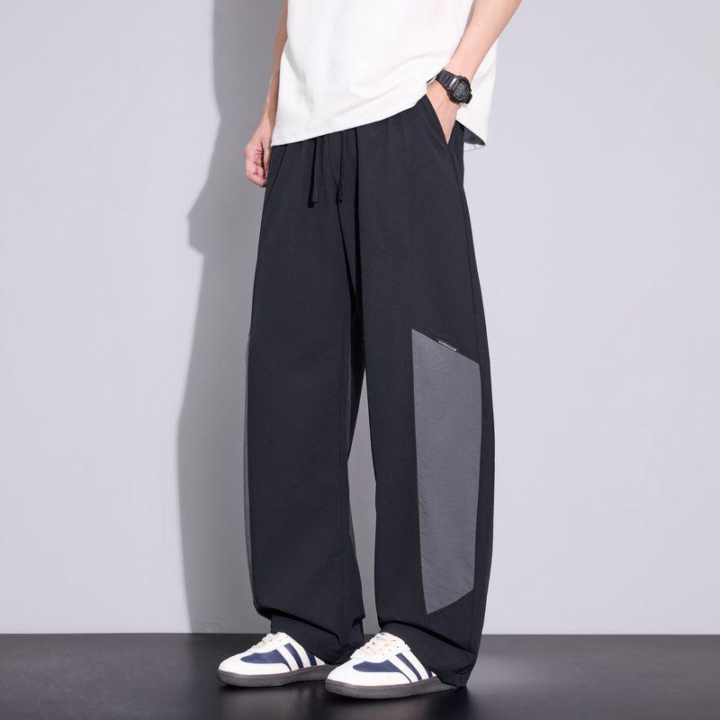 Spring and summer new scimitar loose straight ice silk contrasting color splicing black casual pants men's very light pants