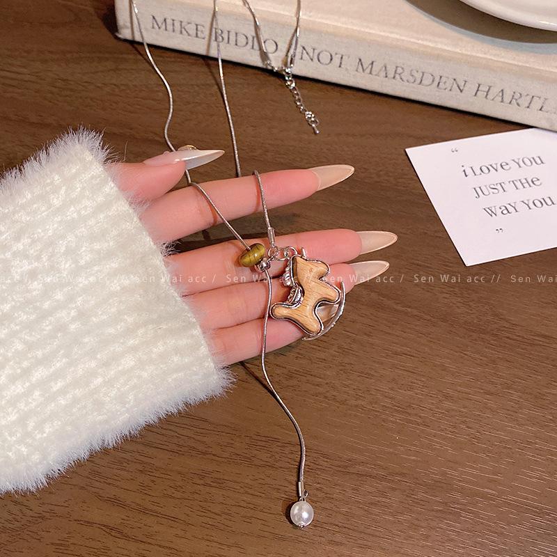 Cartoon Trojan horse pendant necklace women's 2025 new autumn and winter long sweater chain retro natal year good luck accessories