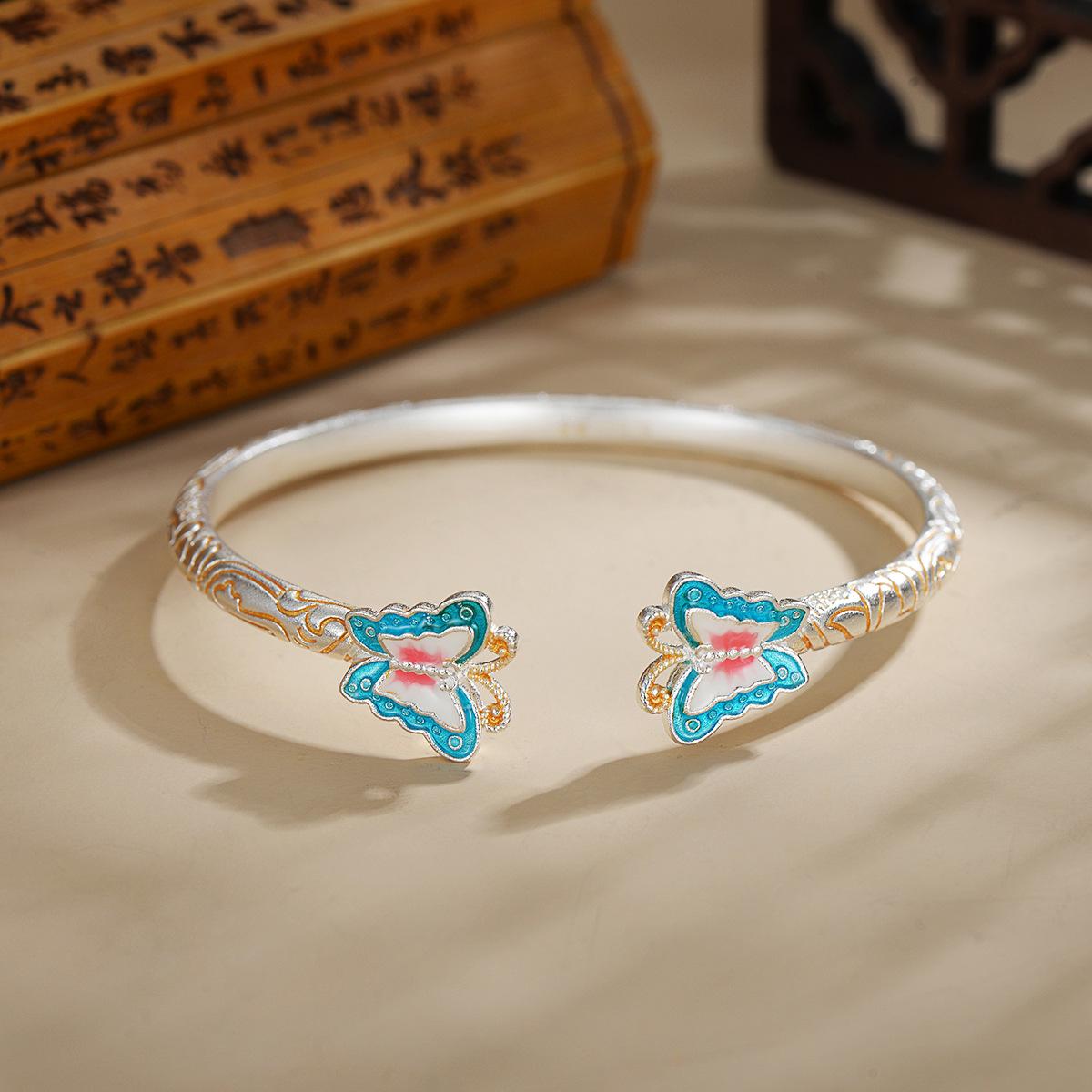 

Antique French Cloisonné Enamel Butterfly Bracelet, Silver-Plated White Copper, with Scenic Motifs and Exclusive Scrollwork Design