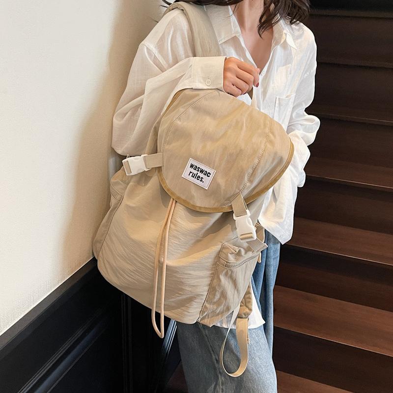 Schoolbag1011 new Korean niche lightweight nylon canvas backpack casual fashion drawstring travel large capacity backpack