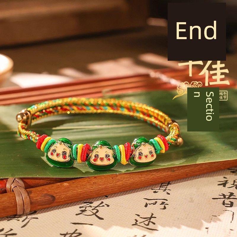 

Праздник Драконьих лодок Красочный веревочный браслет Ручного плетения Ручная веревка Взрослый Красная веревка Детская Красочная проволока Детские украшения Подарок Gold silk color rope three dumplings [Green 2]]