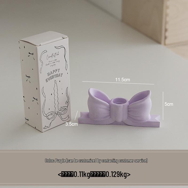 

Gypsum Bowknot Candlestick: Ins Style Dining Table Ornament with Long Stem Scented Candle in White and Pink.