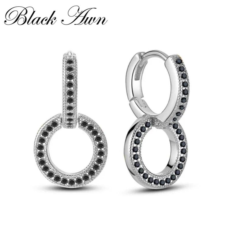 Czarno-białe kolczyki z biżuterią