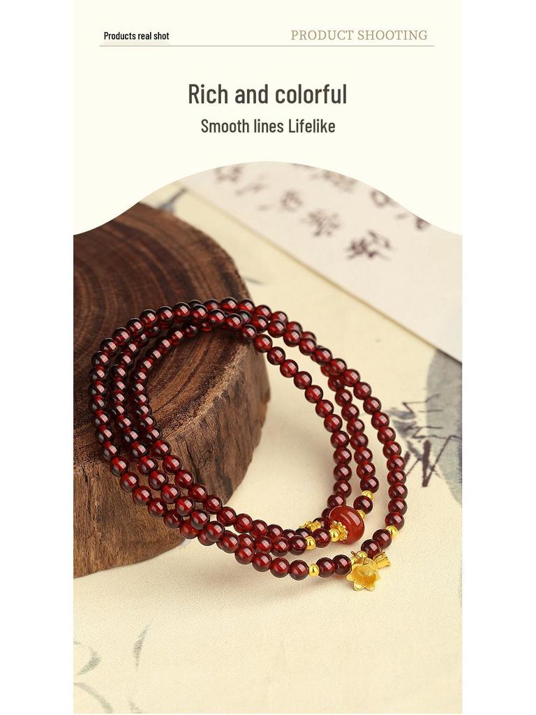 High-End Chinesischer Stil S925 Sterlingsilber Granat Maiglöckchen Blume Perlen Damenarmband