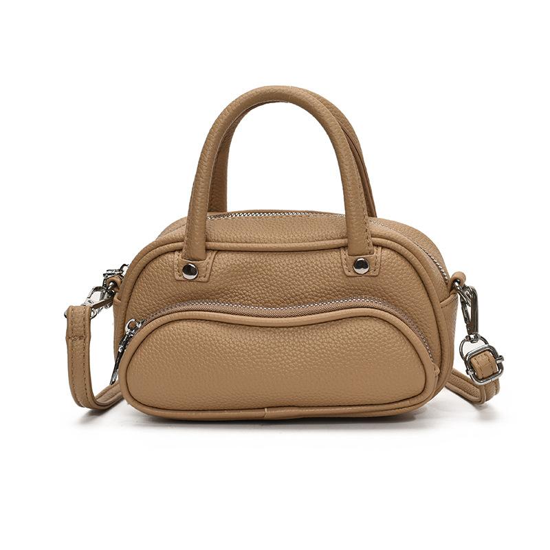 Korean version of trendy simple lychee pattern cream portable pillow bag women's leisure commuting versatile high-end messenger bag