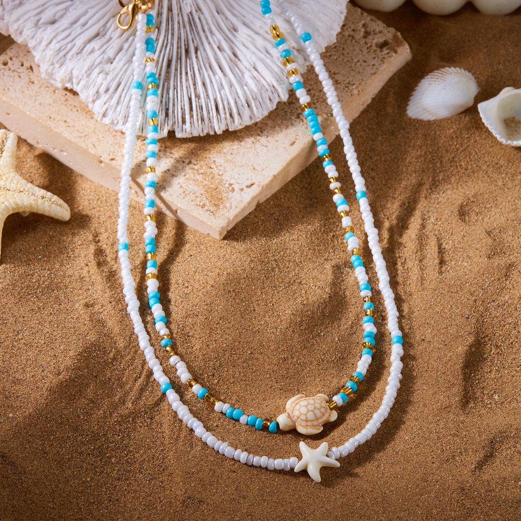 Perlenketten-Set für Damen 2 Stück Samenperlen-Choker mit Meeresschildkröte Seestern Anhängern Layering Sommer Boge Strand Schmuck