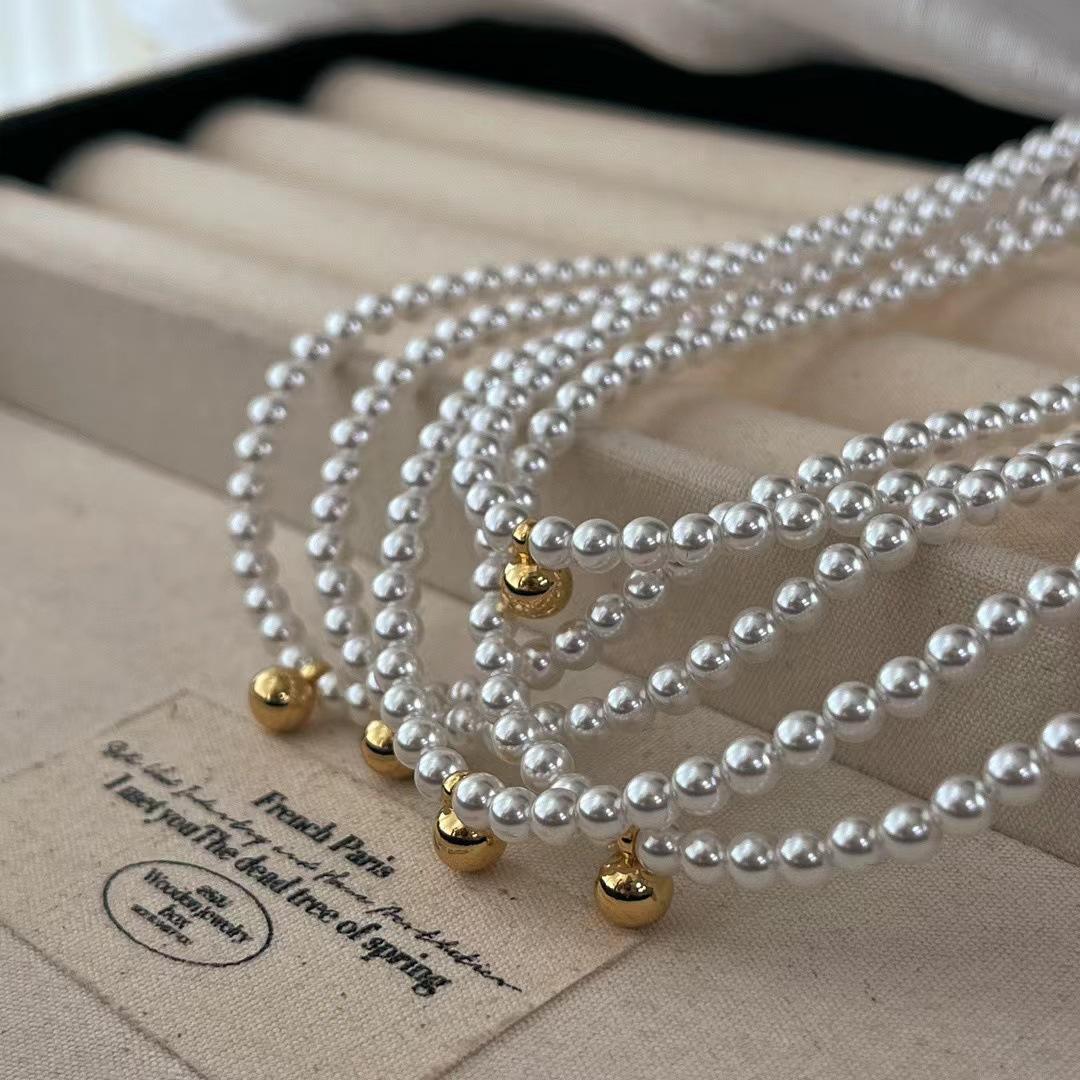 

Retro Round Temperament, Versatile Small Light Bulb, Shijia Small Gold Ball Pendant, Baby Pearl Collarbone Chain Atmosphere