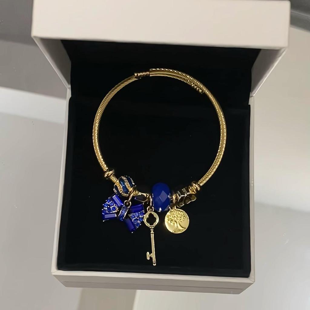 Panjia Fashion Gold Stainless Steel Bowknot Bracelet with Crystal Beads and Rhinestone Pendant.