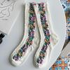 1 par middels lange, varme sokker til kvinner, med blomstermønster og etnisk trykk, crew socks for høst og vinter