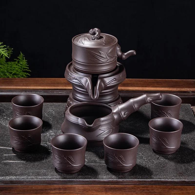 

Purple Clay Stone Grinding Semi-automatic Tea Set Creative Kung Fu Tea Hot Sales of Tea Set.Creative