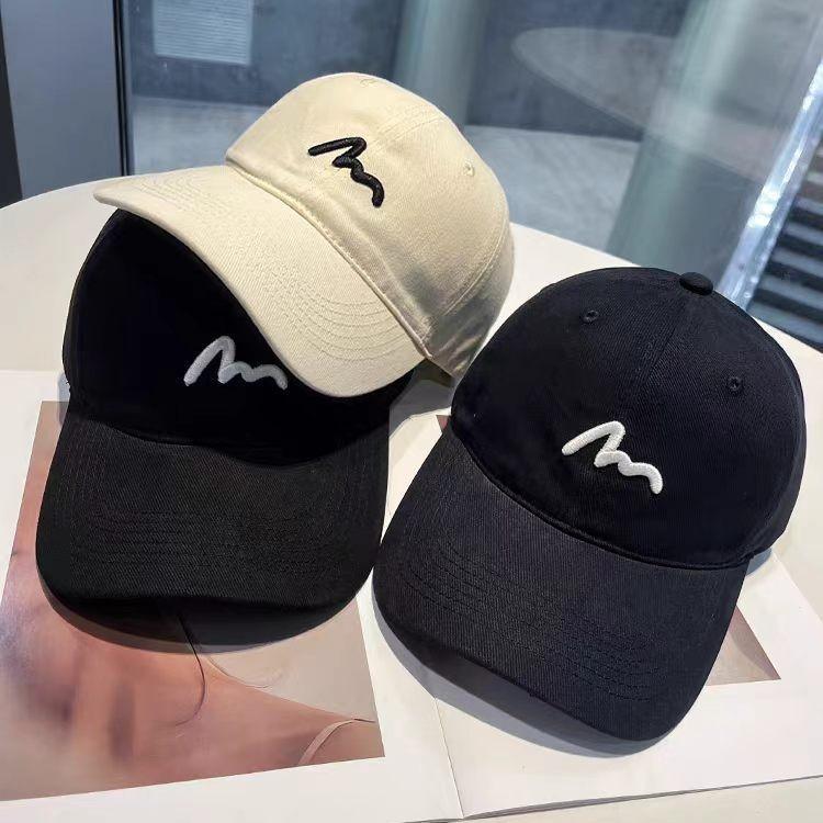 Embroidered baseball cap, lightweight and breathable for outdoor activities, designed to enhance facial features with a simple and stylish look