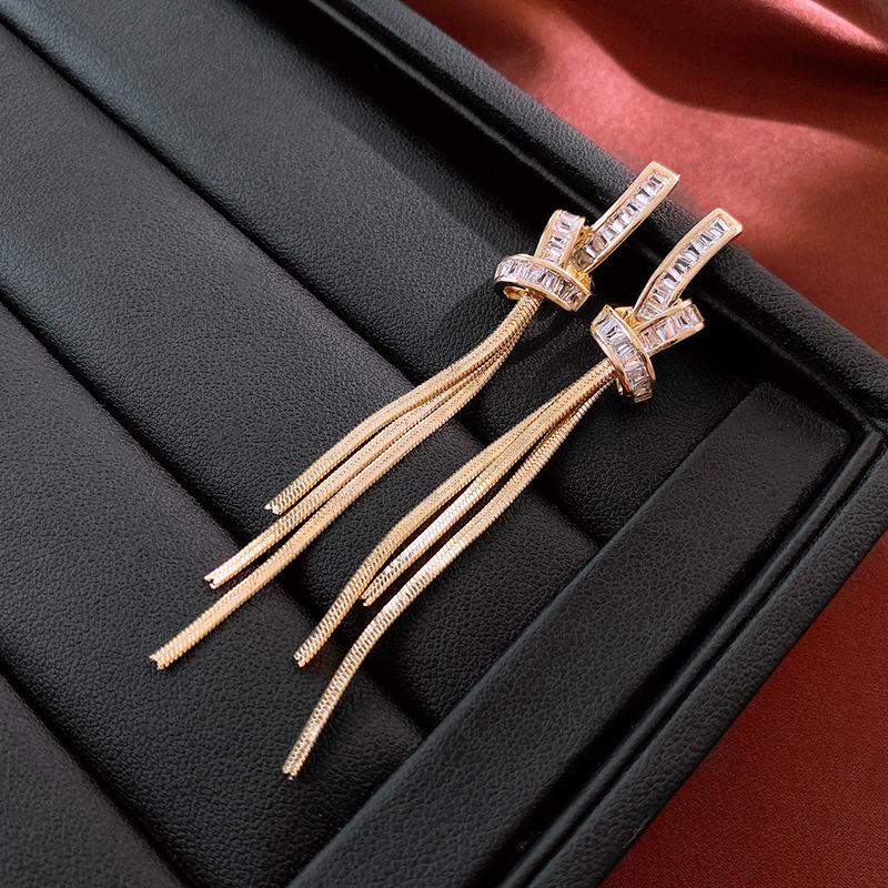 Premium metal knotted zircon fringed silver needle earrings real gold electroplating simple and elegant niche earrings