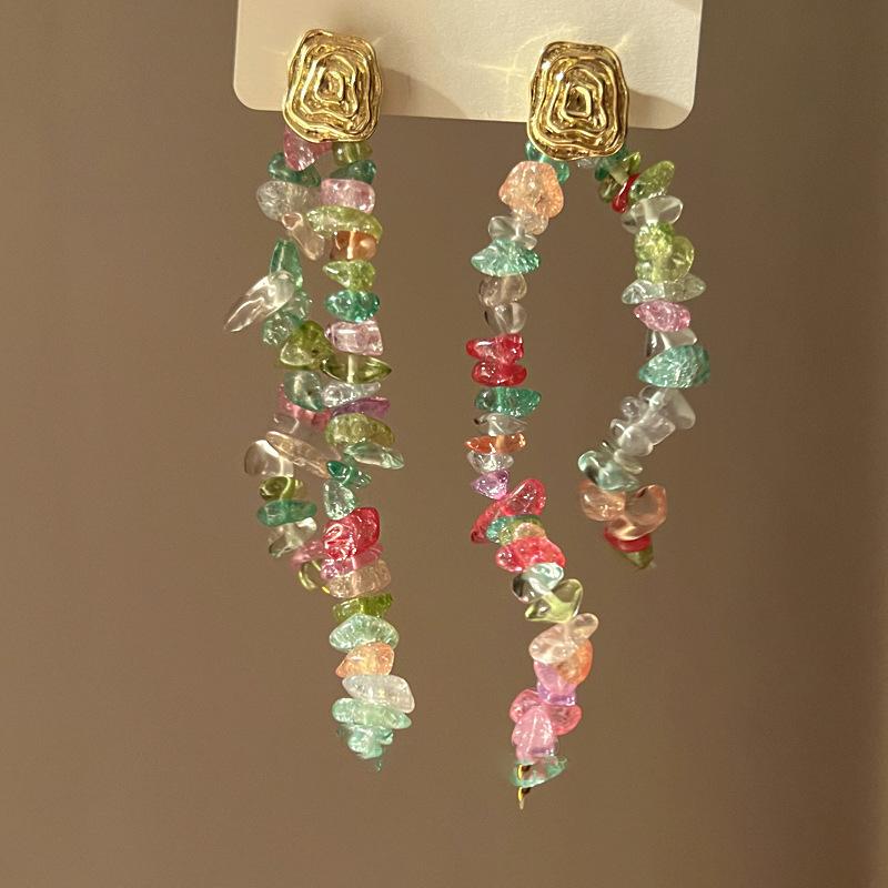Boucles d'oreilles bohèmes roses à fleurs de perles de rocaille et pompons de perles