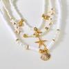Boho Mehrschichtige Seestern Muschel Reiskorn Perlen Halskette für Damen Vintage Imitation Perlenstein Halskette Sommer Strandparty Schmuck