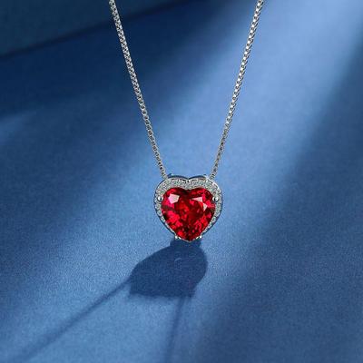 Heart-Shaped Jewelry Set: Pendant, Stud Earrings, and Ring with Imitation Ruby Main Stone.
