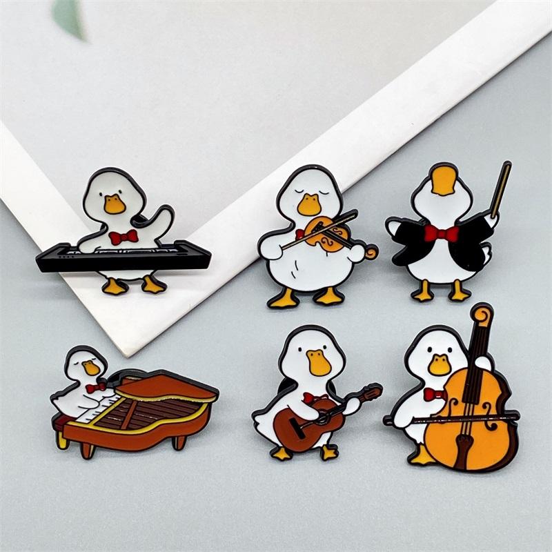 Cute Musician Duck Enamel Brooch Creative Cartoon Violin Piano Baton Guitar Animals Lapel Pins Backpack Jewelry Gifts For Kids