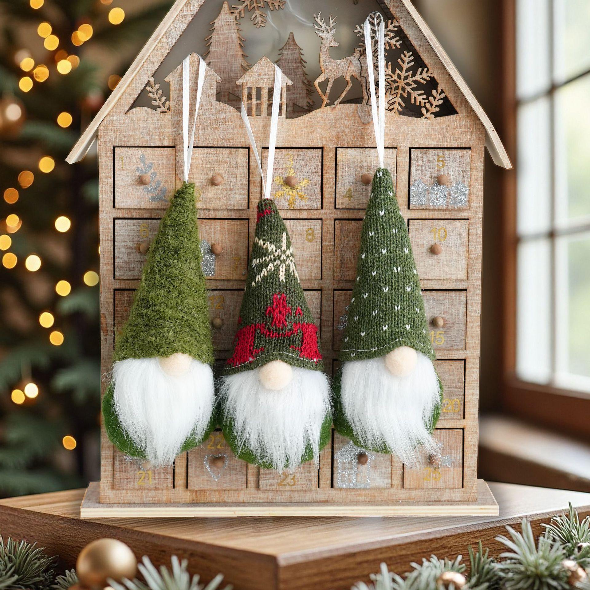 

A set of three Christmas tree pendants. The red pendant of the faceless old Man on the Christmas tree is suitable for Christmas
