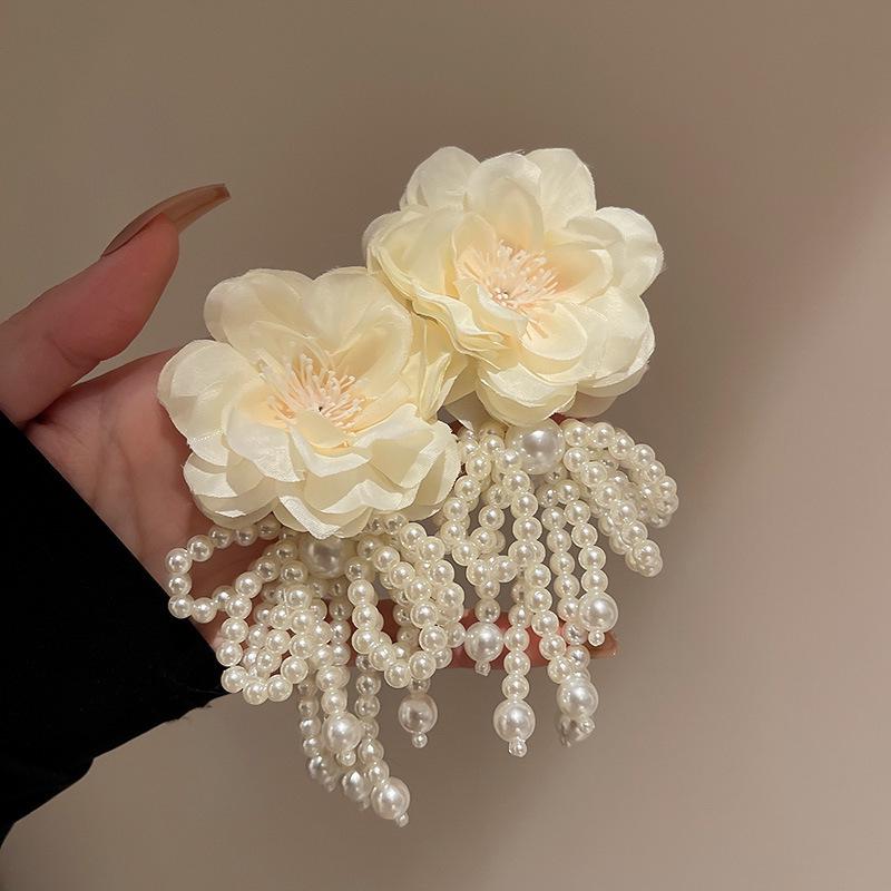 Exquisite Silver Needle Flower Bow Tassel Earrings - Luxury European & American Style for Women