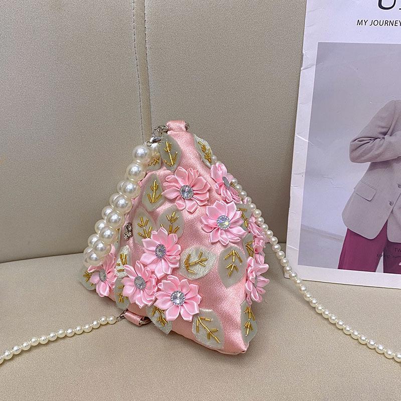 

style literary and artistic, sweet and shiny, inlaid with diamonds, flowers and leaves, zongzi-shaped portable messenger bag