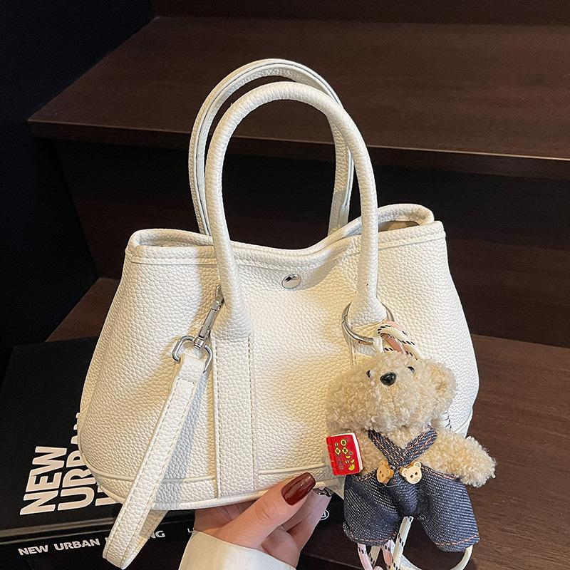 New Niche Simple Leisure Commuter Portable Bucket Bag Versatile Design Sense Solid Color Messenger Bag Women