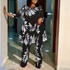 Women Plus Size Three Quarter Sleeve Irregular Hem Printed Top Round Neck Wide Leg Pants Two Piece Coordinate Set