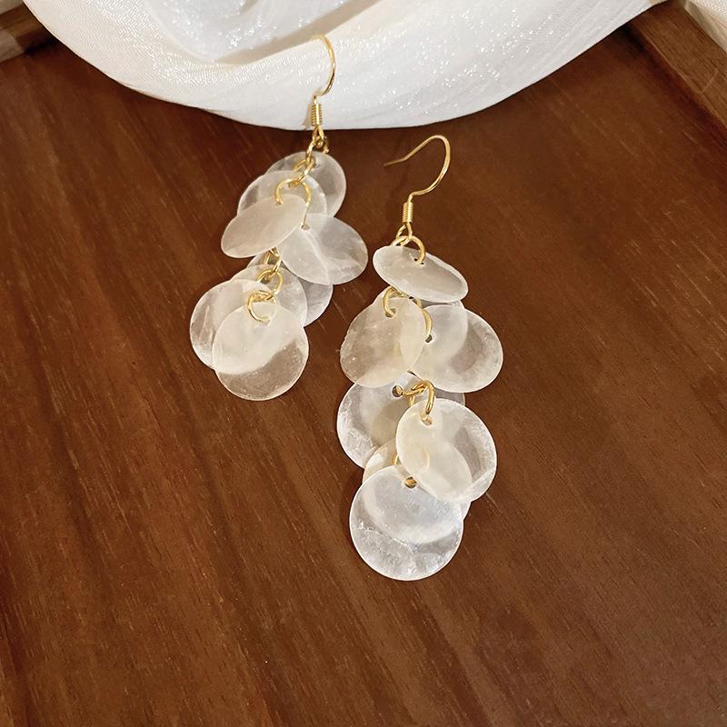 French Round Shell Tassel Stud Earrings: Retro, Exaggerated Style for a Unique Fashion Statement.