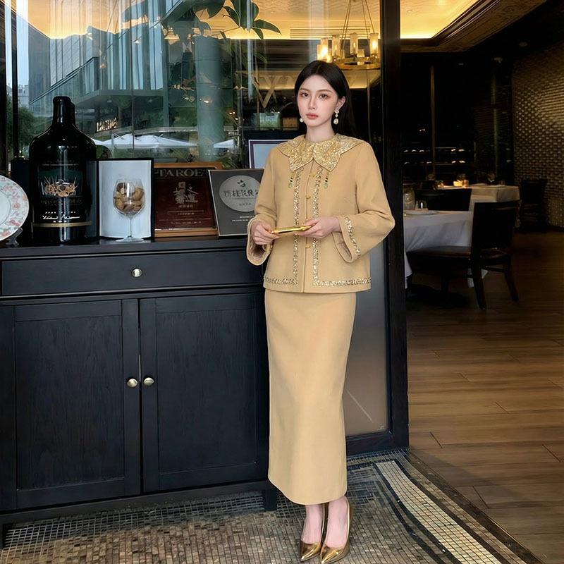 Autumn and winter national style new Chinese temperament heavy industry embroidery design jacket + cloud shoulder skirt two-piece set female NZ111
