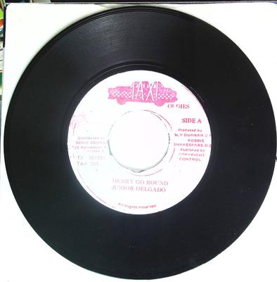 7inch Record JUNIOR DELGADO - Merry Go Round / Fort Augustus TXI867281 Taxi Oldies Jamaica Reggae, Ska & Dub Used