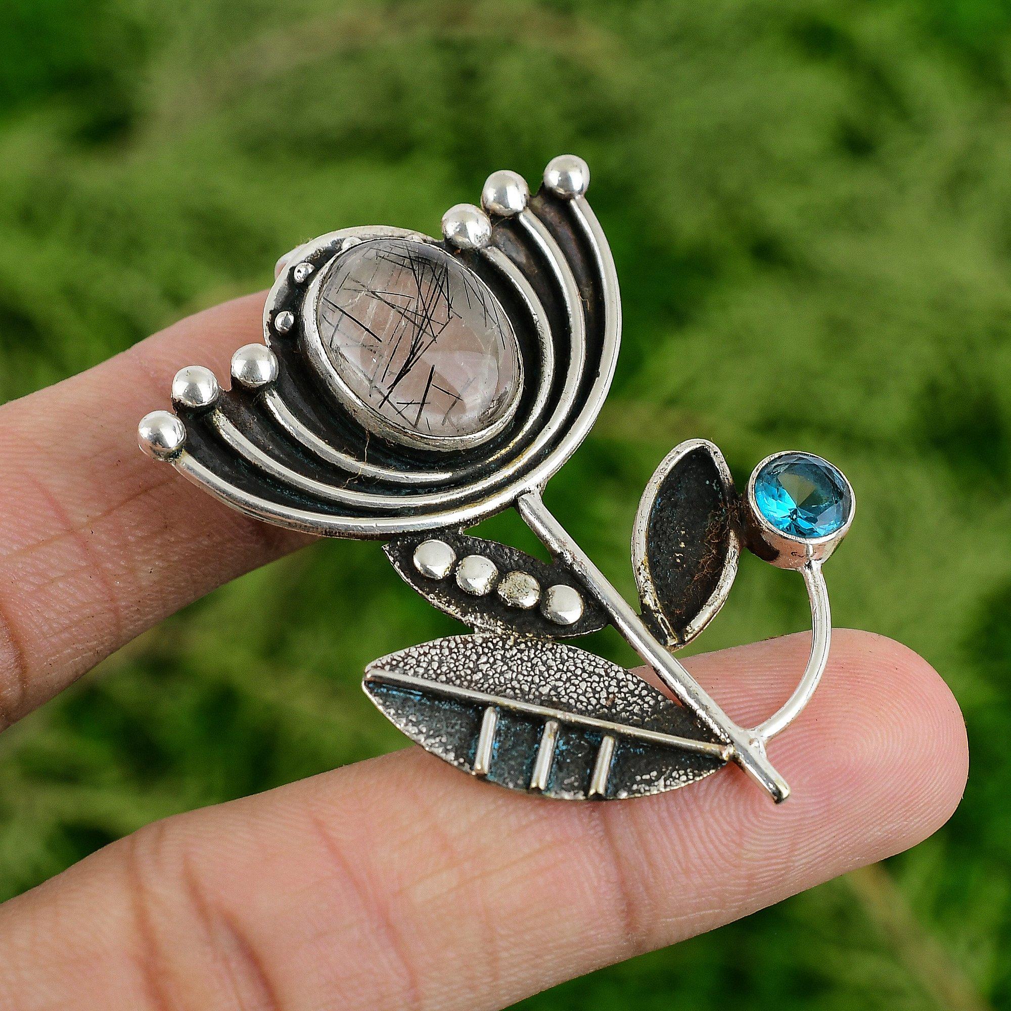 

Подвеска из стерлингового серебра с драгоценным камнем черный рутиловый кварц и швейцарским голубым топазом в форме лотоса