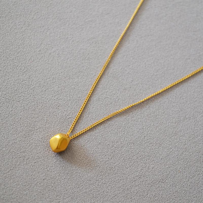 Gold-Plated Brass Pendant Necklace with Irregular Faceted Design - Retro, Versatile, and Stylish.