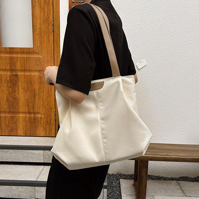 Bolsa de lona grande de cor sólida para mulher 2025 nova bolsa de ombro casual estilo ins para estudante universitário