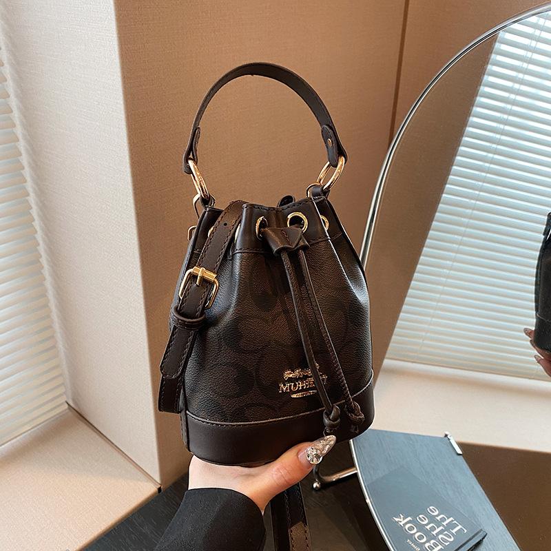 Ms. Baos nye allsidige messengerbag, bærbar bøtteveske.