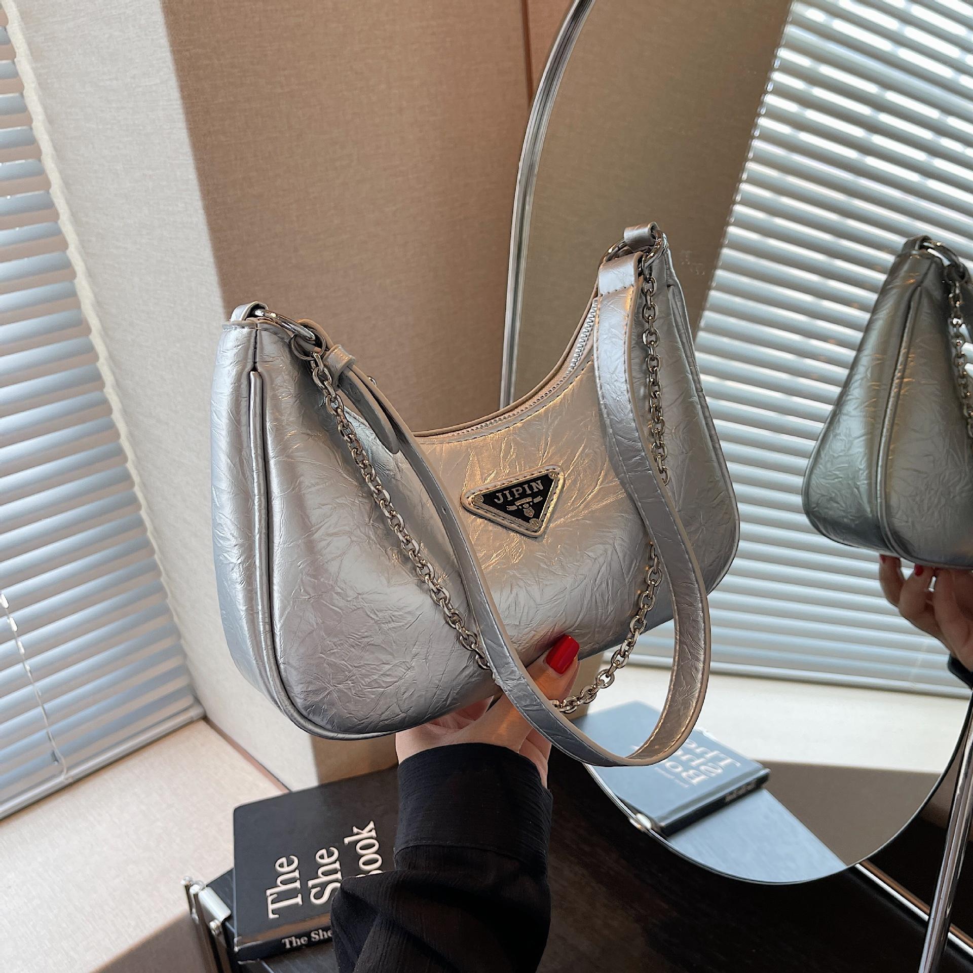 

Нова висококласна нішева дизайнерська сумка жіноча популярна універсальна сумка через плече сумка-під пахвою 15cm*24cm*6cm срібний