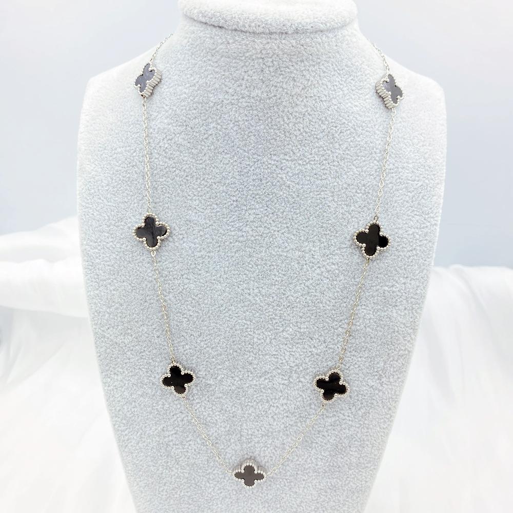 Collier de fleurs de trèfle à quatre feuilles pour la mode féminine, tempérament de luxe léger, chaîne de pull haut de gamme à sept fleurs