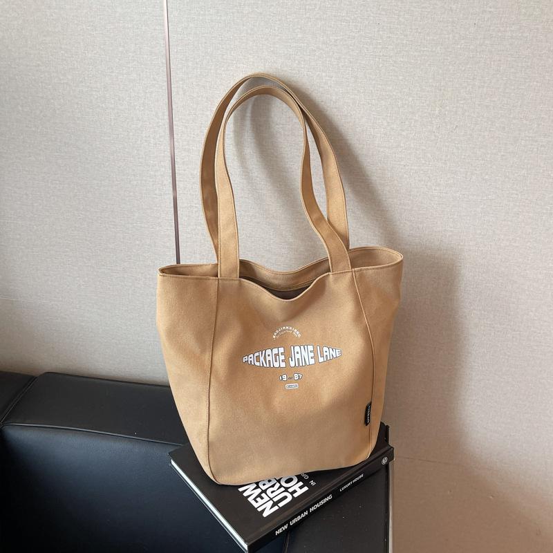 

Canvas bag women s large capacity 2025 new summer versatile simple shoulder bag casual college student tote bag коричневый