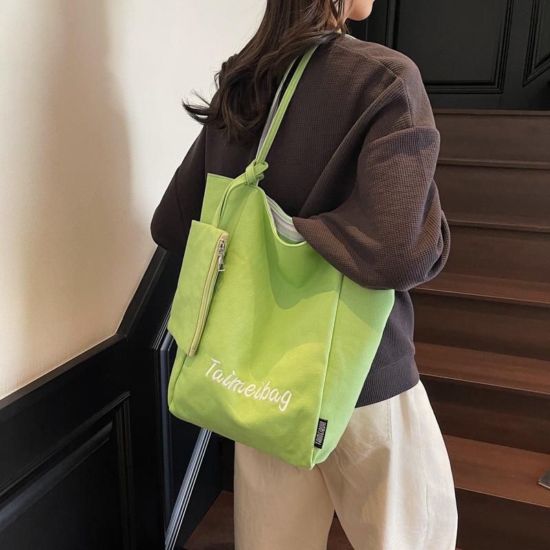 Korean version of casual large-capacity underarm bag women's 2025 new striped canvas bag double-sided back shoulder bucket bag