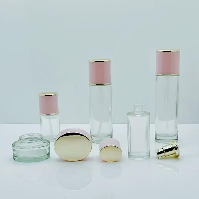 Pink Lady Skincare Set: Glass Bottles (30ml & 50ml) and Cream Jars (30g & 50g).