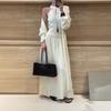 Korean Version Knitted Suit Women's Autumn and Winter Lazy Wind Knitted Cardigan Neck Vest Skirt Three-piece Set