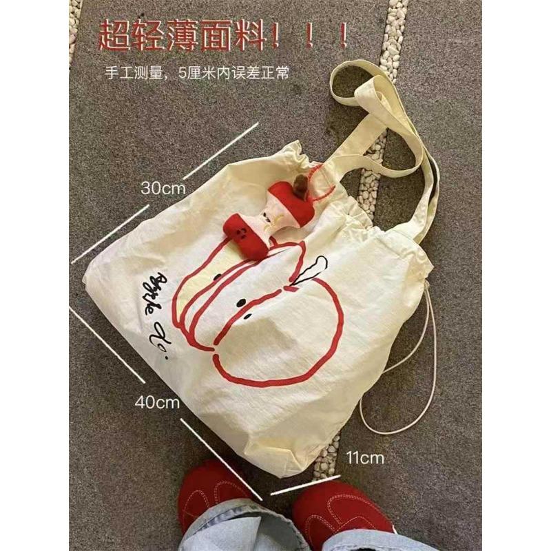 

Apple s new drawstring canvas bag, student light commuting versatile shoulder bag, niche large-capacity simple tote bag