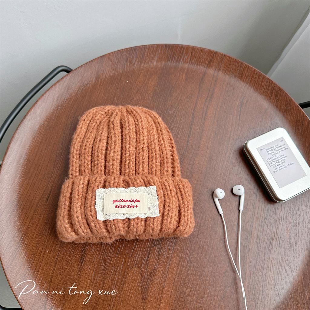 Neue Spitze Etikett Kinder Wollmütze Nuojiji Student Herbst und Winter Neu Warm und Vielseitig Ohrenschutz Strickmütze