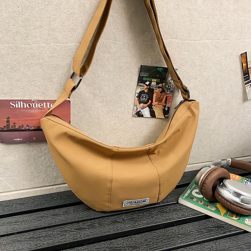 2025 new trendy Korean style sports versatile commuter bag shoulder horn messenger bag women's casual dumpling bag