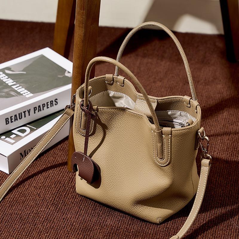 Summer new fashion leather bucket bag niche first layer cowhide retro single shoulder diagonal span portable vegetable basket bag