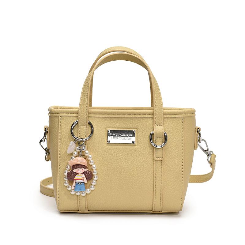 Spring hot sale lychee pattern high-end portable bucket bag Korean version casual small fresh temperament versatile messenger women's bag