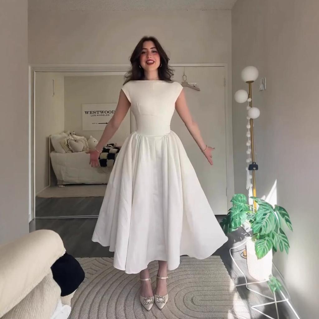 Europäische und amerikanische Damenbekleidung Sommer Neu Französisches Temperament Schlank und Dünn Großer Saum Rückenloses A-Linien-Kleid