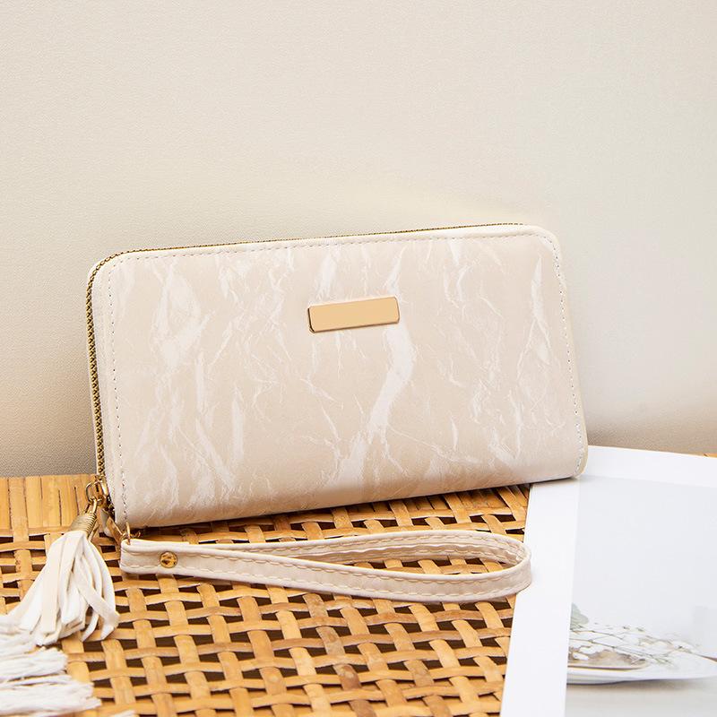 Spring and summer new simple multi-card position hand-held women's bag, fringed zipper, long wallet, and a wallet.