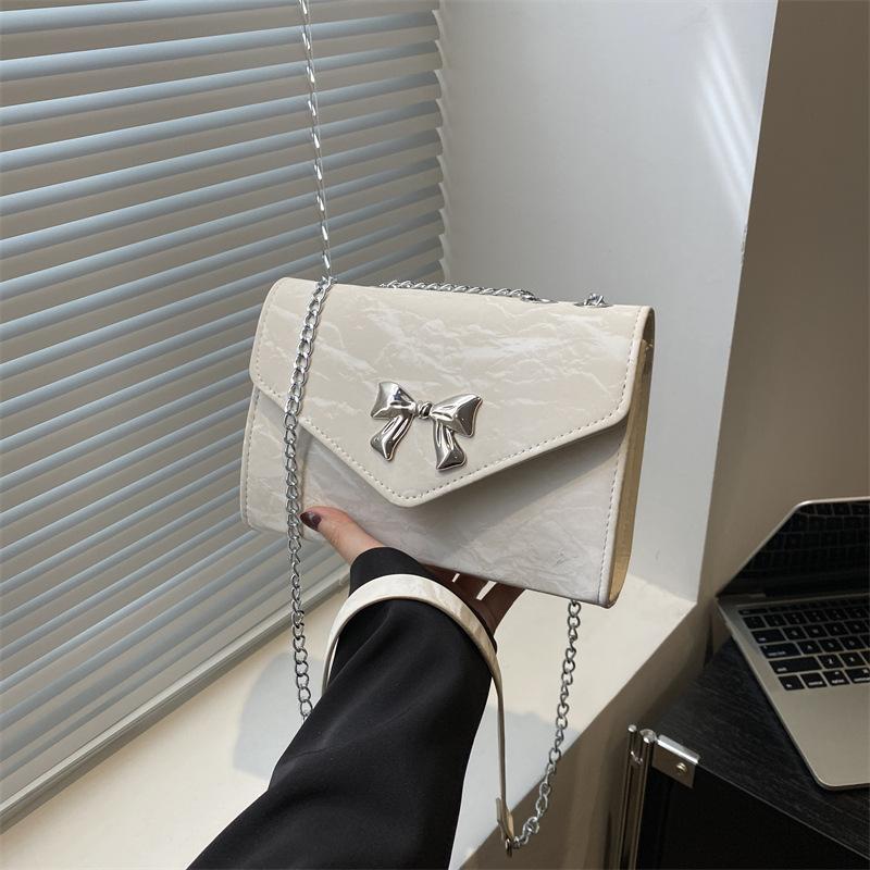 Textured bag women's 2025 new bow chain shoulder bag foreign style personality trendy crossbody commuter small square bag