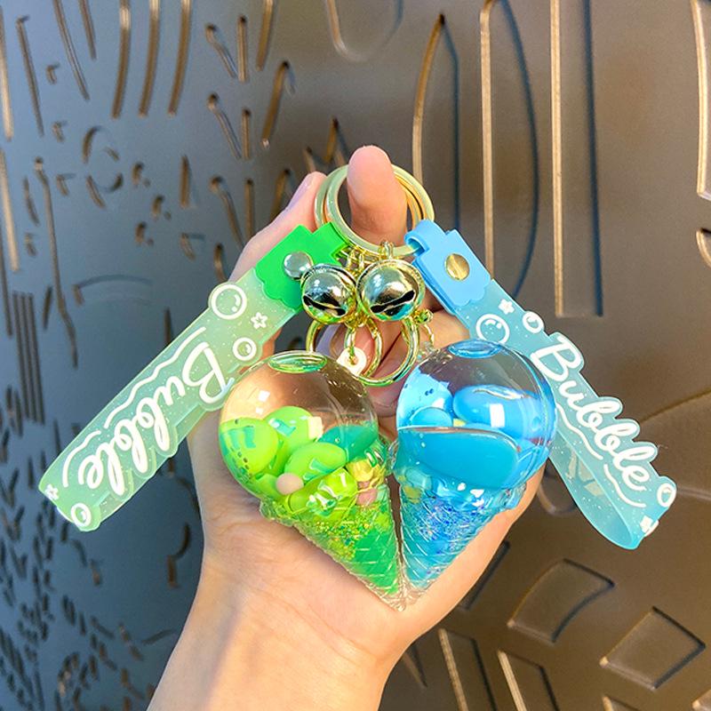 Akrylový přívěsek na klíče s tekutým pískem a obsahem oleje - Perfektní malý dárek na tašku nebo do auta.