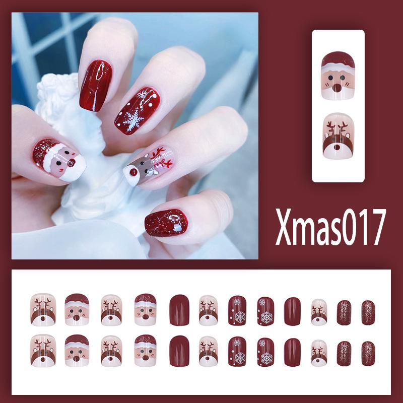 Playful Winter Glitter Nail Tips: Reindeer & Snowflake Design