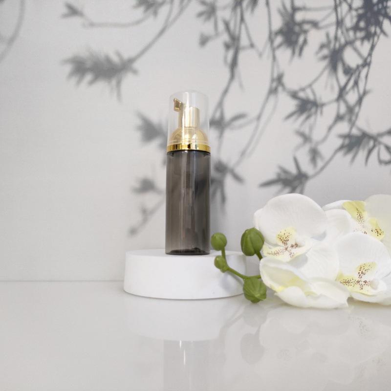 Available 60ml Transparent Black Foam Mousse Bottle for Face Wash and Travel-friendly Cosmetic Packaging.